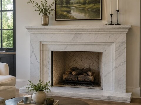 Traditional white marble mantel fireplace surround with raised hearth